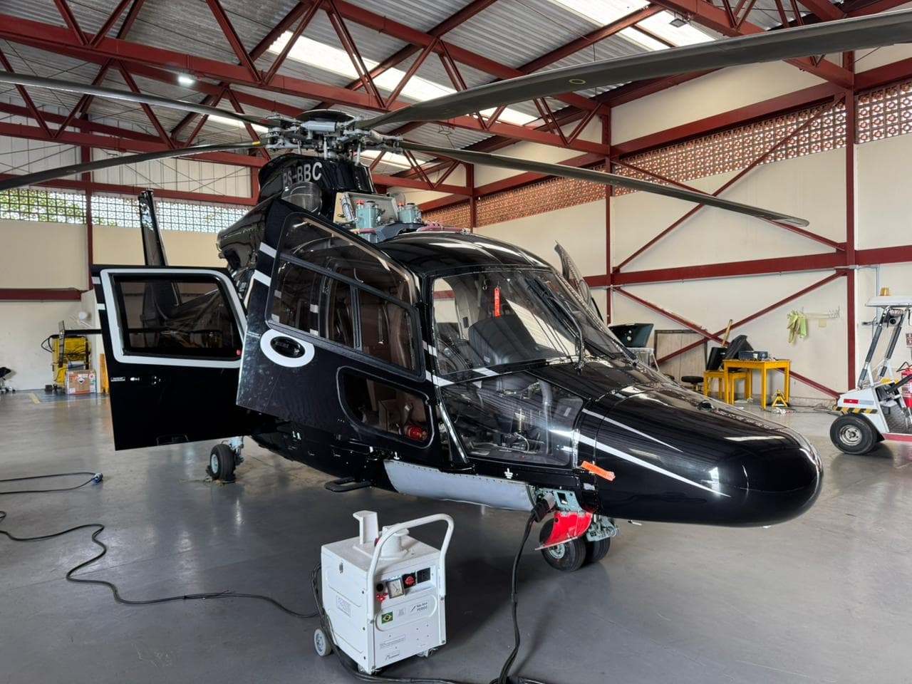 Helibarra helicopter parked inside the hangar